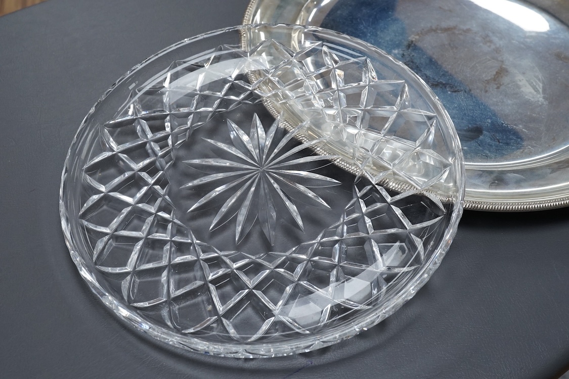 An Italian 800 standard white metal shallow plate with glass insert diameter 30.2cm, together with two Austro-Hungarian 800 standard white metal shaped oval dishes, 40.1oz.
